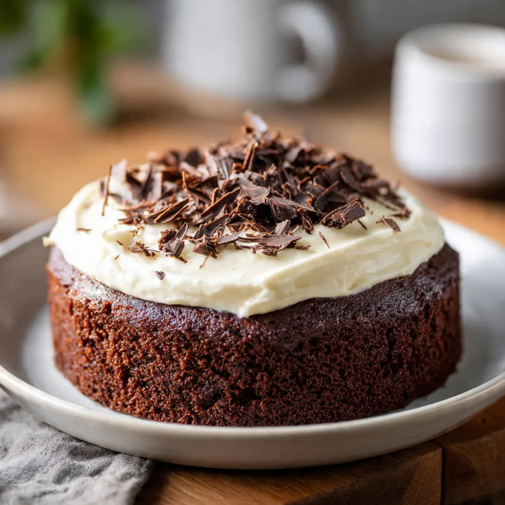 Slice of Chocolate Neiman Cake with cream cheese frosting