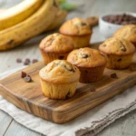 Quick Mini Banana Muffins – Perfect for On-the-Go Snacks 12 Mini Banana Muffins on a rustic board