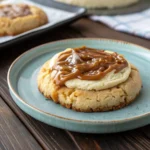Crumbl Salted Caramel Cheesecake Cookie with caramel drizzle