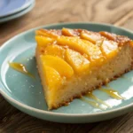 Mango Upside Cake slice on blue plate