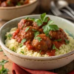 Moroccan meatballs in tomato sauce over couscous