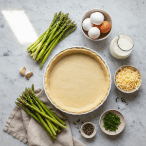 top down flat lay of asparagus quiche ingredients